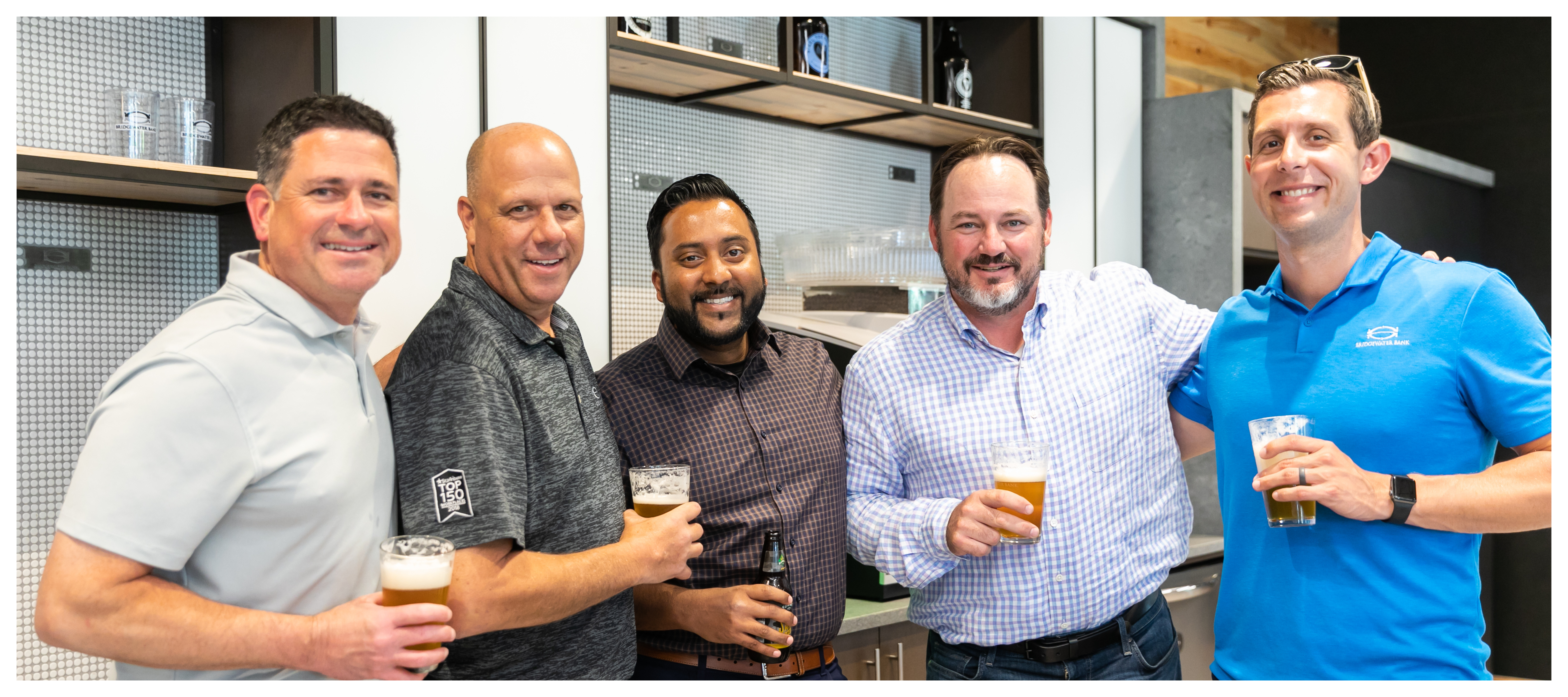 Group photo of Prestige Trust Capital team members at an internal happy hour.