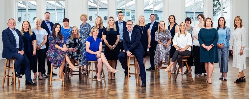 Photo of Prestige Trust Capital team celebrating.